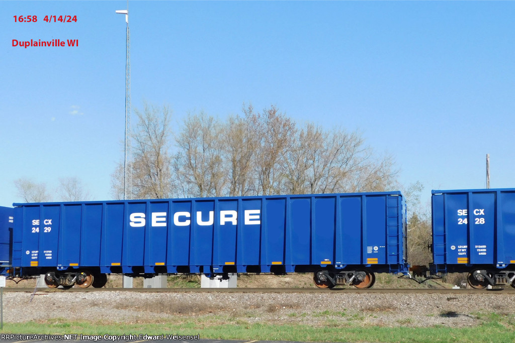 Seventeen new GE lease gondolas roll north on CN - wonder what SECURE is